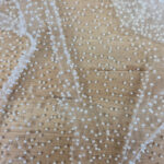 Mesh embroided with pearls