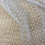 Tulle with embossed polka dots